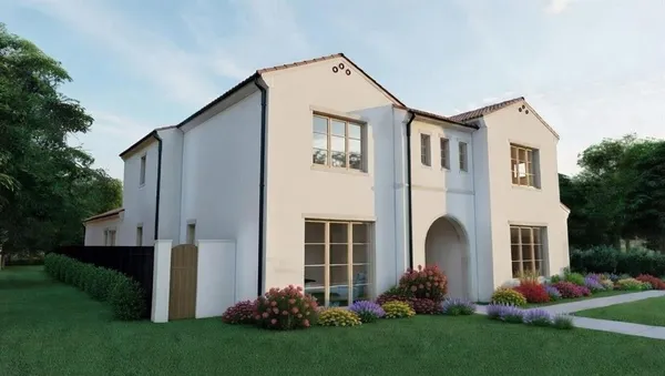 a front view of a house with garden