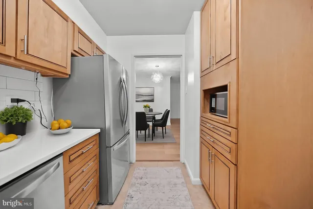 a bedroom with a bed a television and a large window