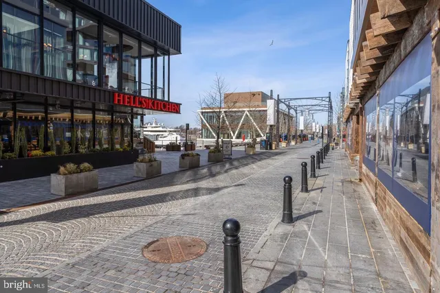 a kitchen with stainless steel appliances a refrigerator and a stove