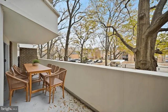 a kitchen with stainless steel appliances granite countertop a sink a stove and cabinets