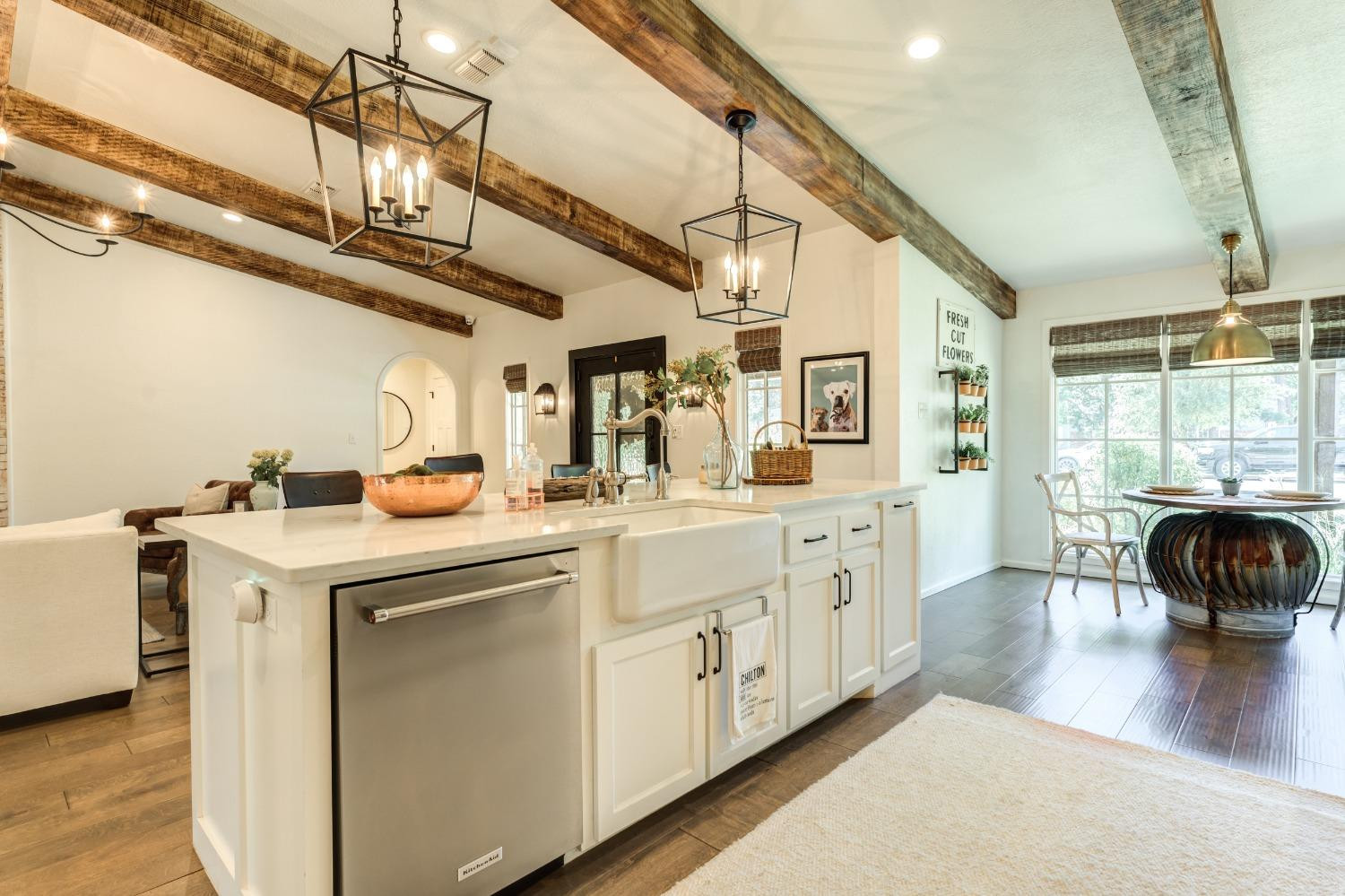 4520 8th Street Lubbock, TX 79416 - Photo 12 of 49 a kitchen with a stove a sink and a refrigerator