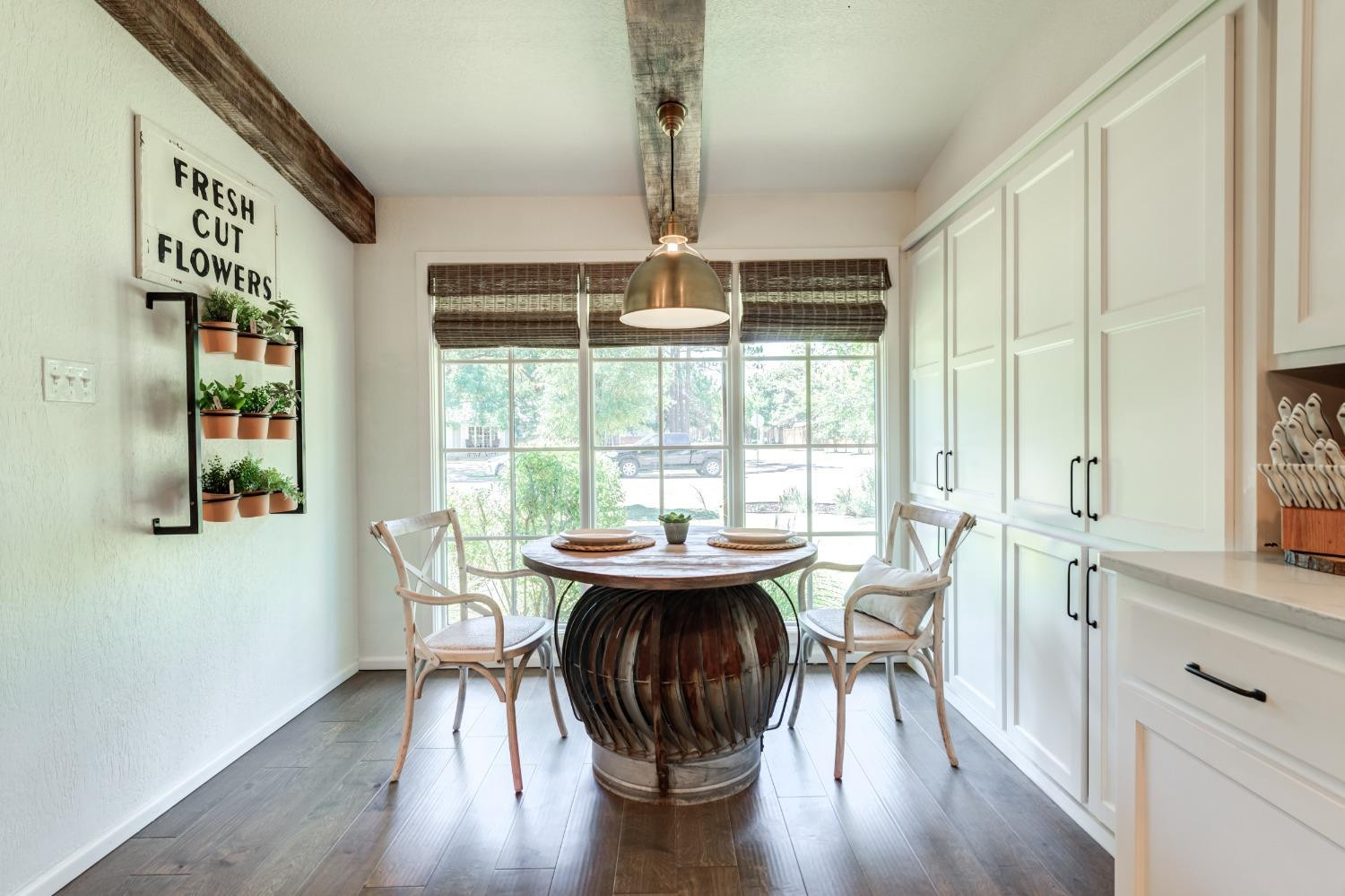 4520 8th Street Lubbock, TX 79416 - Photo 15 of 49 a view of a dining room with furniture window and wooden floor