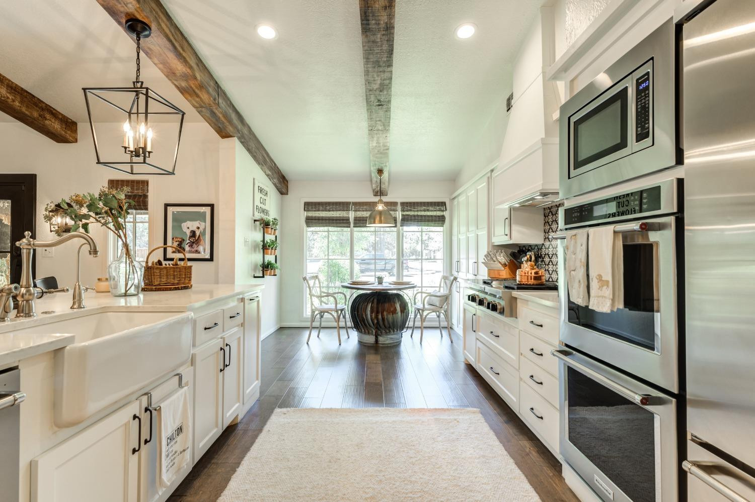4520 8th Street Lubbock, TX 79416 - Photo 18 of 49 a kitchen with cabinets and stainless steel appliances