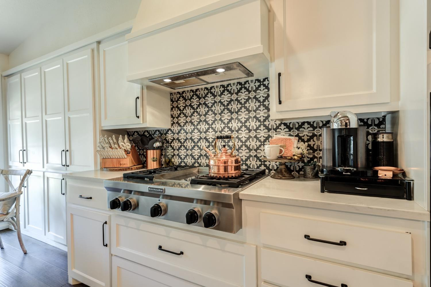 4520 8th Street Lubbock, TX 79416 - Photo 19 of 49 a kitchen with white cabinets and appliances