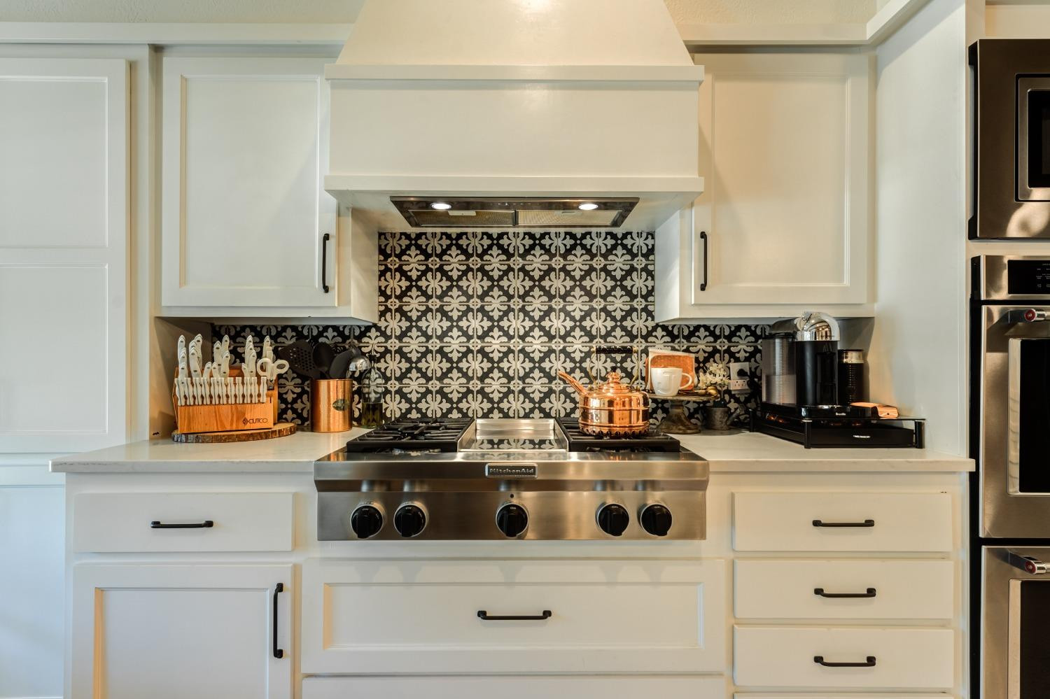 4520 8th Street Lubbock, TX 79416 - Photo 20 of 49 a white stove top oven sitting inside of a kitchen