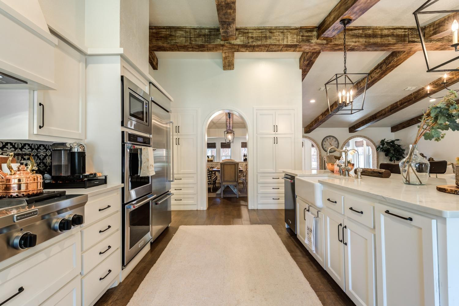 4520 8th Street Lubbock, TX 79416 - Photo 21 of 49 a kitchen with stainless steel appliances kitchen island granite countertop lots of counter top space