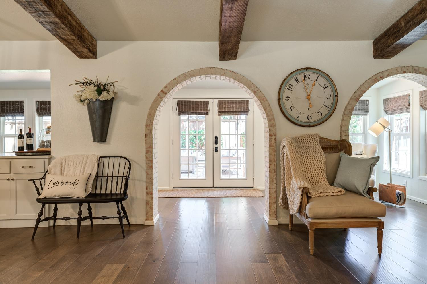 4520 8th Street Lubbock, TX 79416 - Photo 27 of 49 a living room with furniture a window wooden floor and a clock