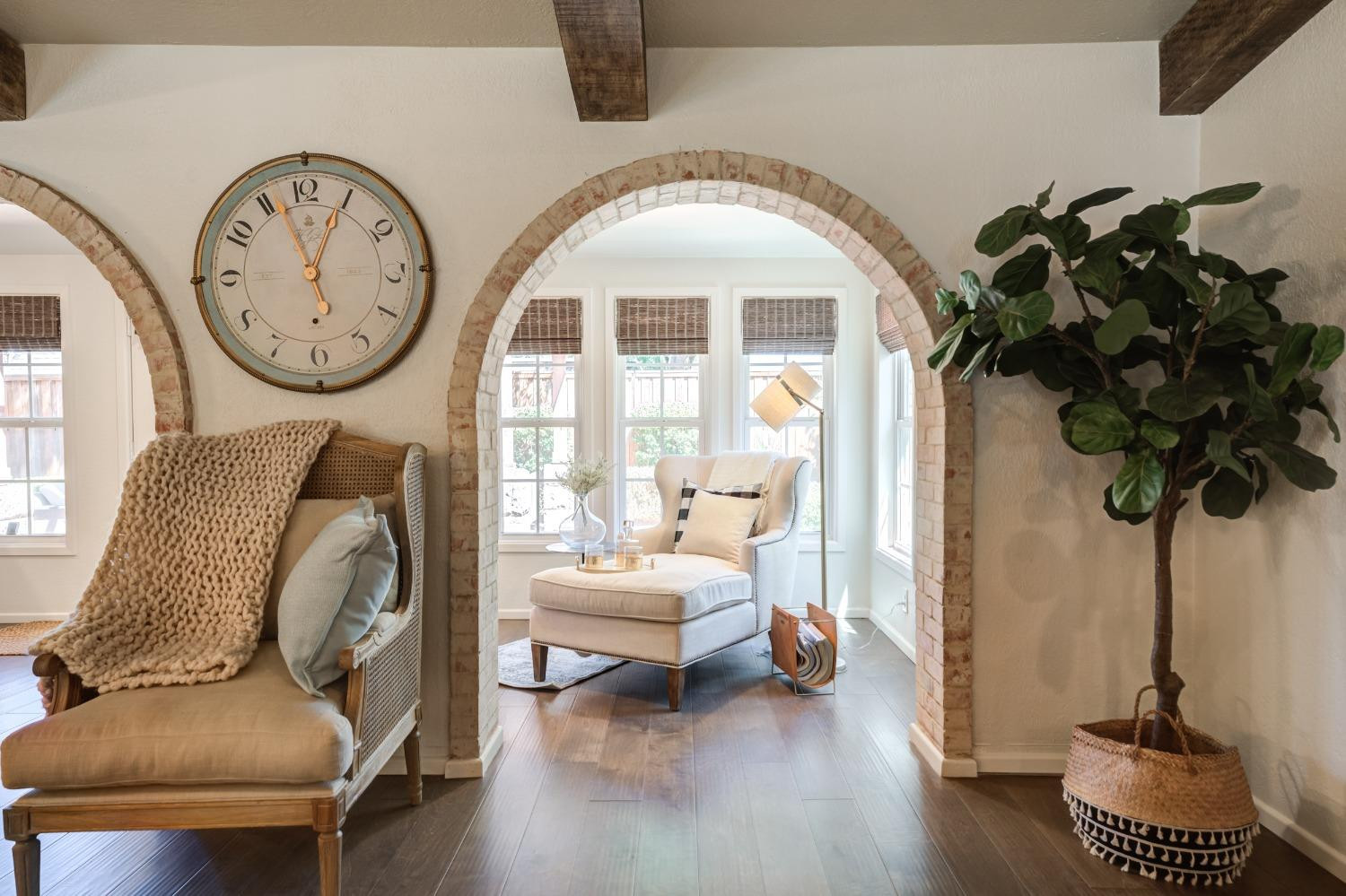 4520 8th Street Lubbock, TX 79416 - Photo 28 of 49 a living room with furniture a clock and a large window