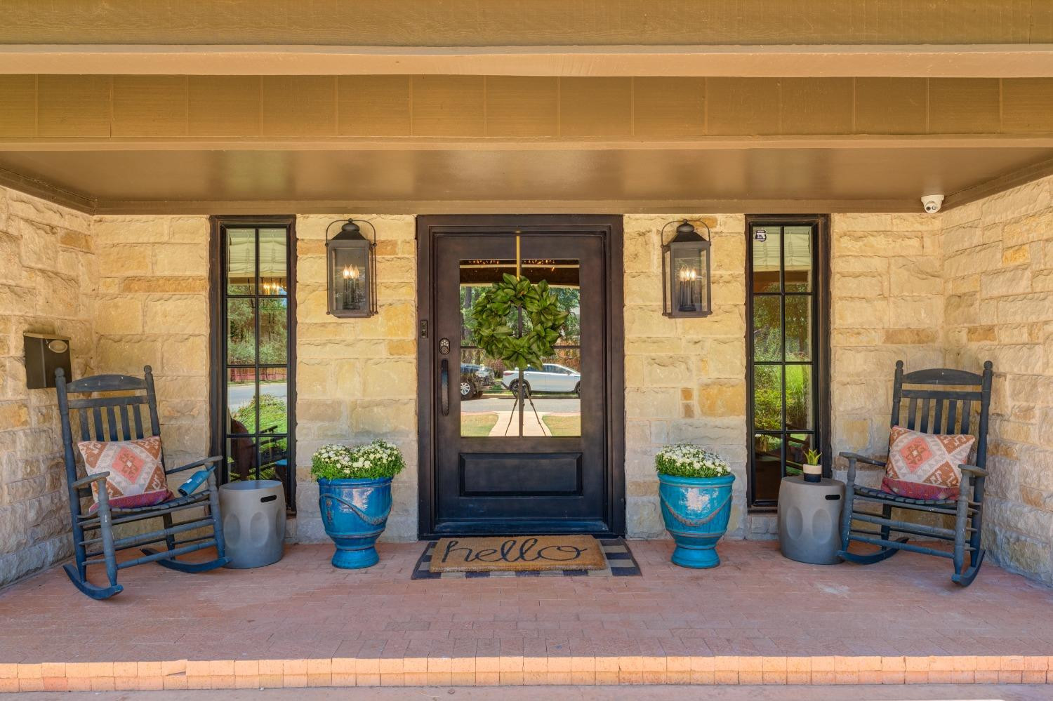 4520 8th Street Lubbock, TX 79416 - Photo 3 of 49 a bedroom with furniture and a potted plant