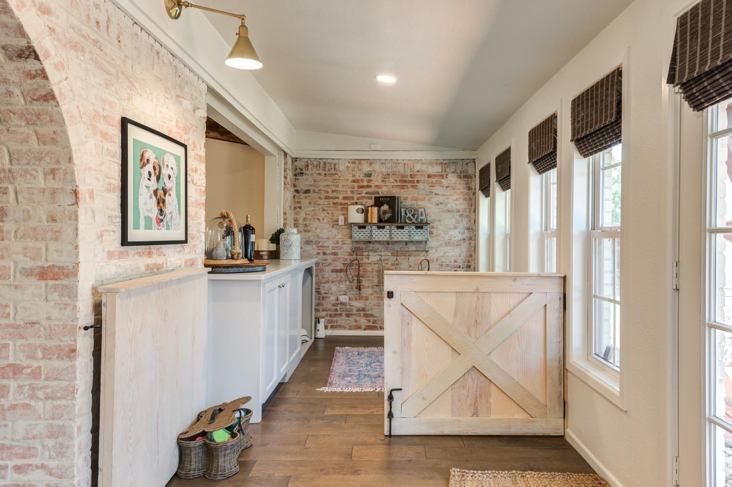 4520 8th Street Lubbock, TX 79416 - Photo 31 of 49 a kitchen with cabinets and wooden floor