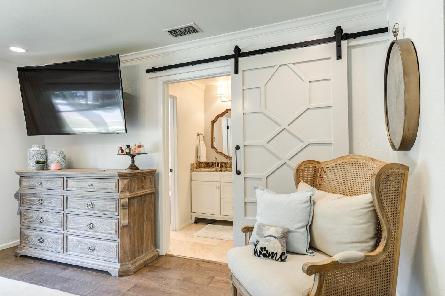 4520 8th Street Lubbock, TX 79416 - Photo 34 of 49 a bathroom with a sink vanity mirror and a mirror