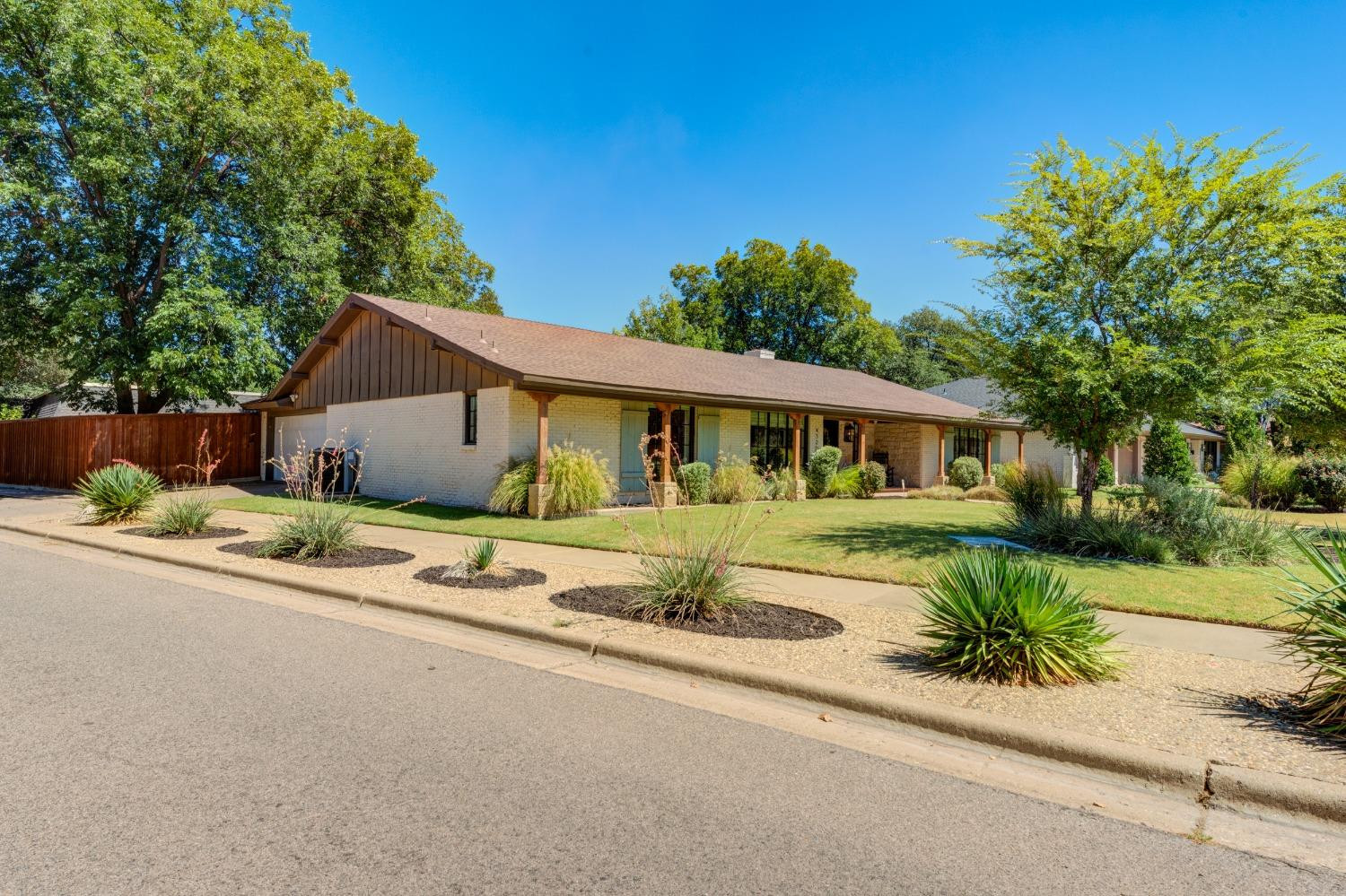 4520 8th Street Lubbock, TX 79416 - Photo 4 of 49 front view of a house with a small yard