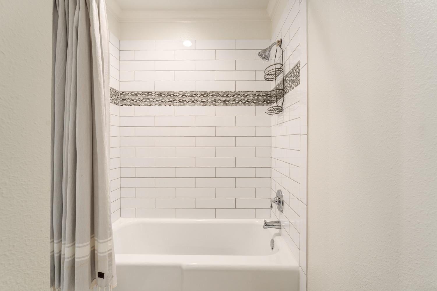 4520 8th Street Lubbock, TX 79416 - Photo 41 of 49 a bathroom with a shower and a bathtub