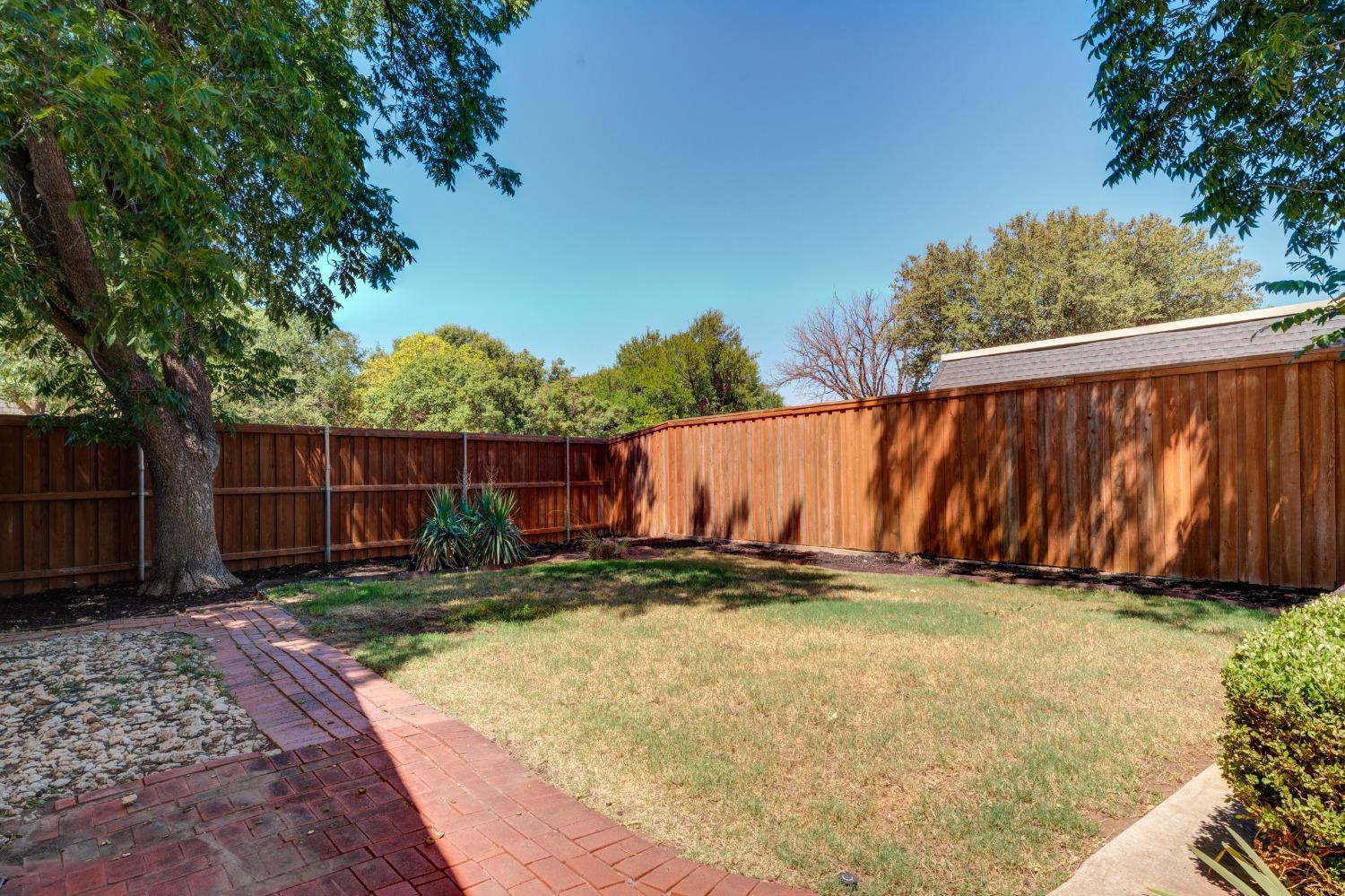 4520 8th Street Lubbock, TX 79416 - Photo 48 of 49 a view of a backyard with wooden fence
