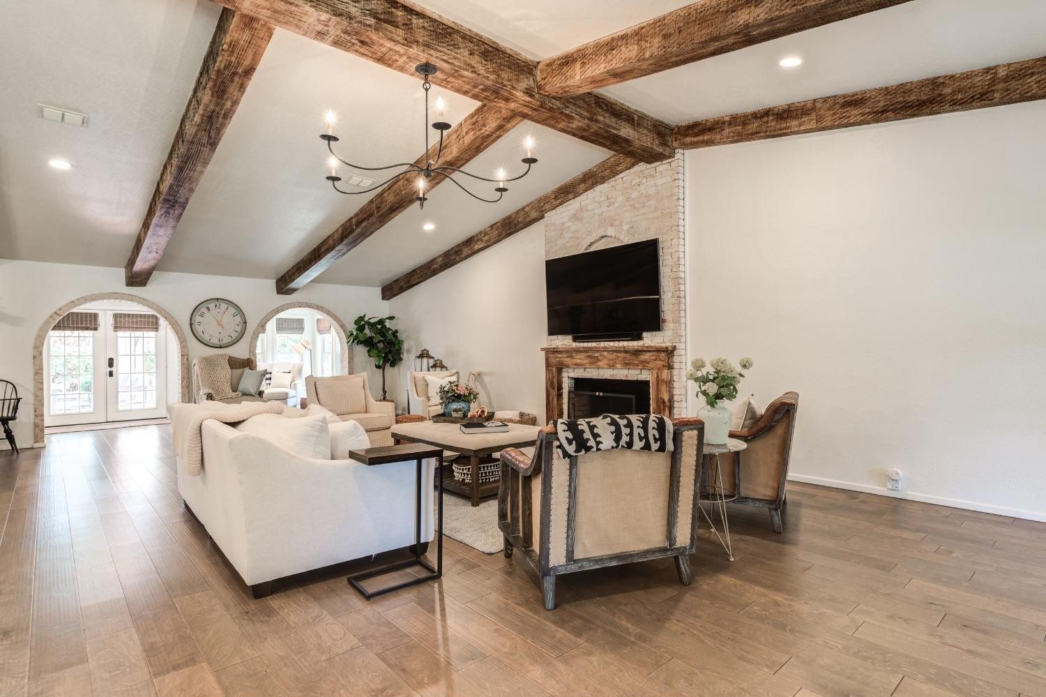 4520 8th Street Lubbock, TX 79416 - Photo 7 of 49 a living room with furniture a fireplace and a flat screen tv