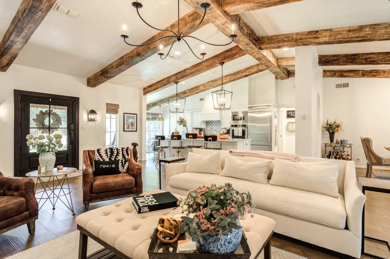 4520 8th Street Lubbock, TX 79416 - Photo 9 of 49 a living room with furniture and a large window