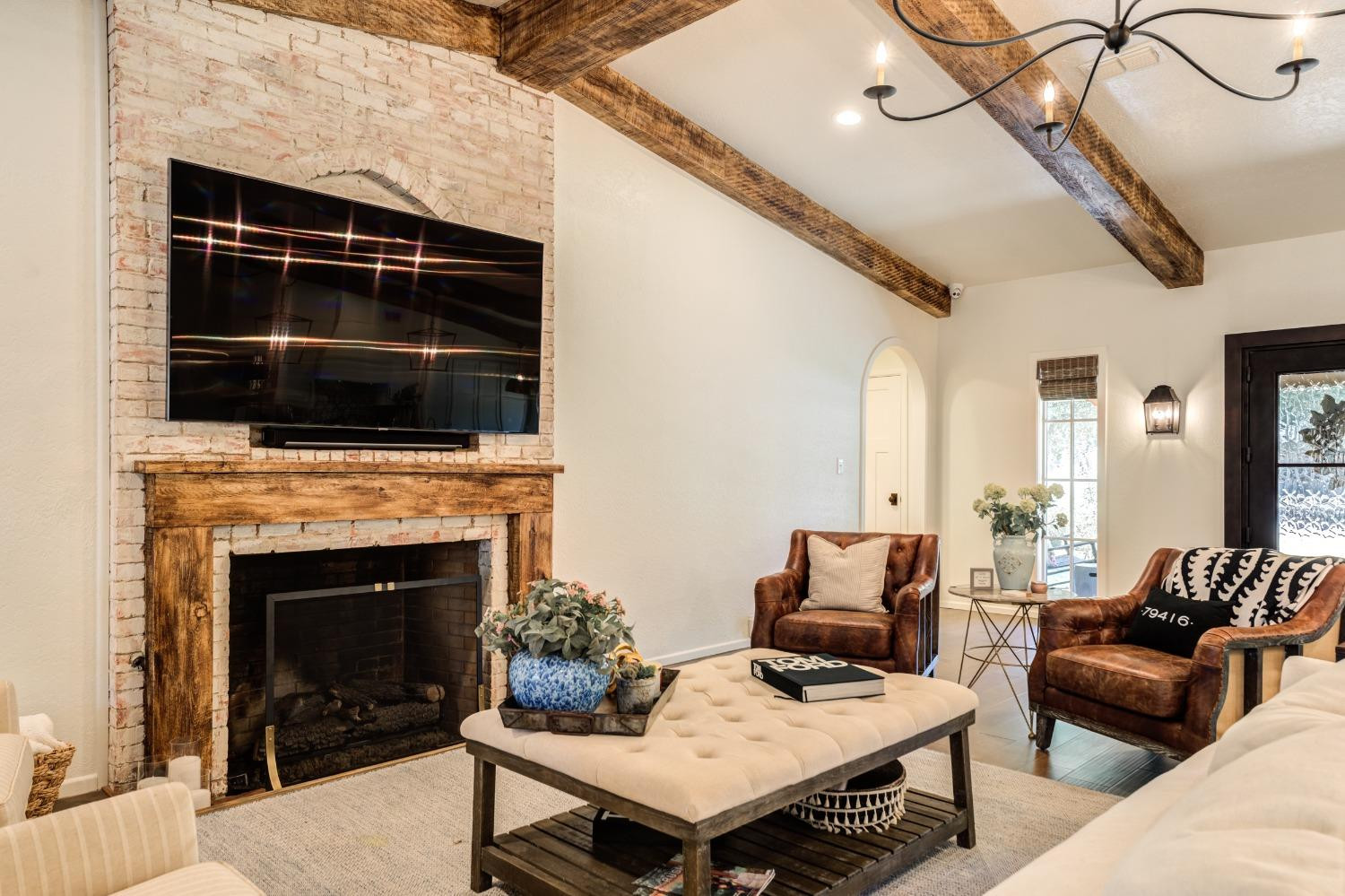 4520 8th Street Lubbock, TX 79416 - Photo 10 of 49 a living room with furniture and a fireplace