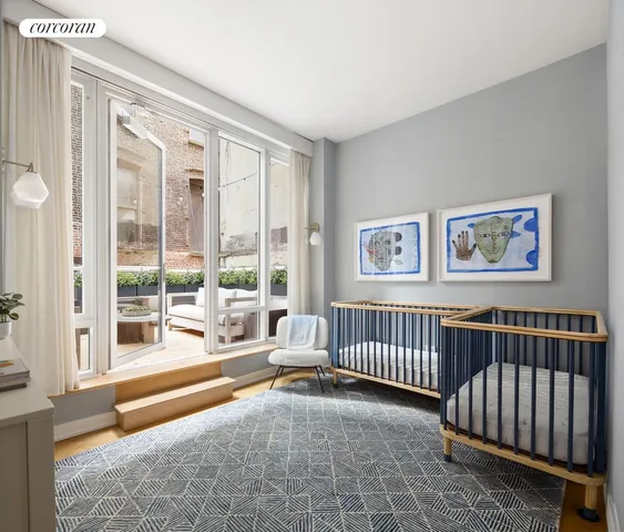 a bedroom with furniture and a large window