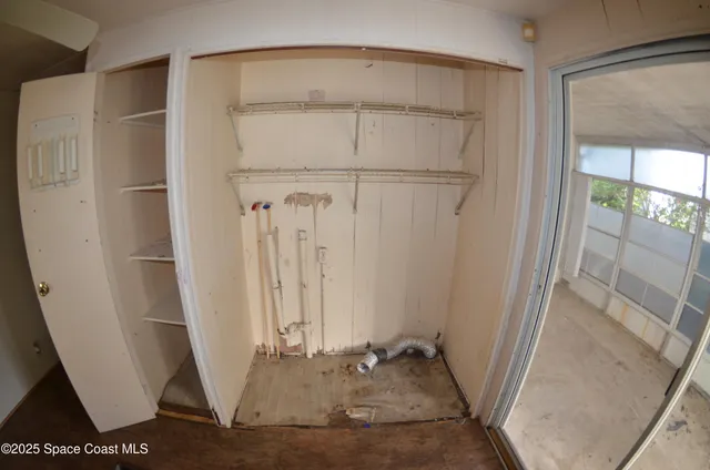 a view of a bathroom with white door