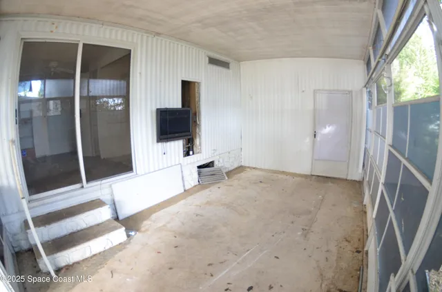a view of a livingroom with a flat screen tv