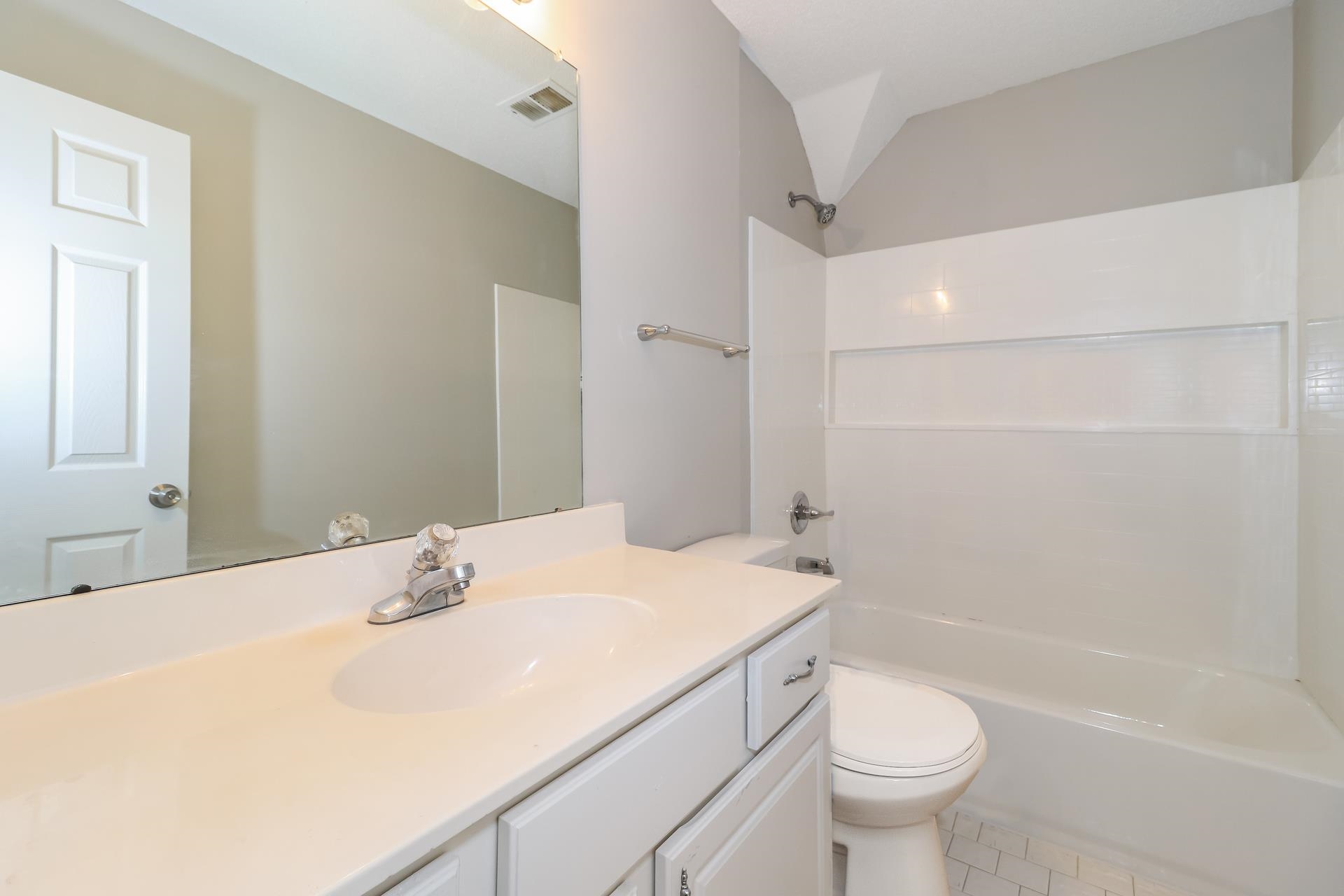 8112 Country Mill Cove Memphis, TN 38016 - Photo 14 of 17 a bathroom with a sink toilet and shower
