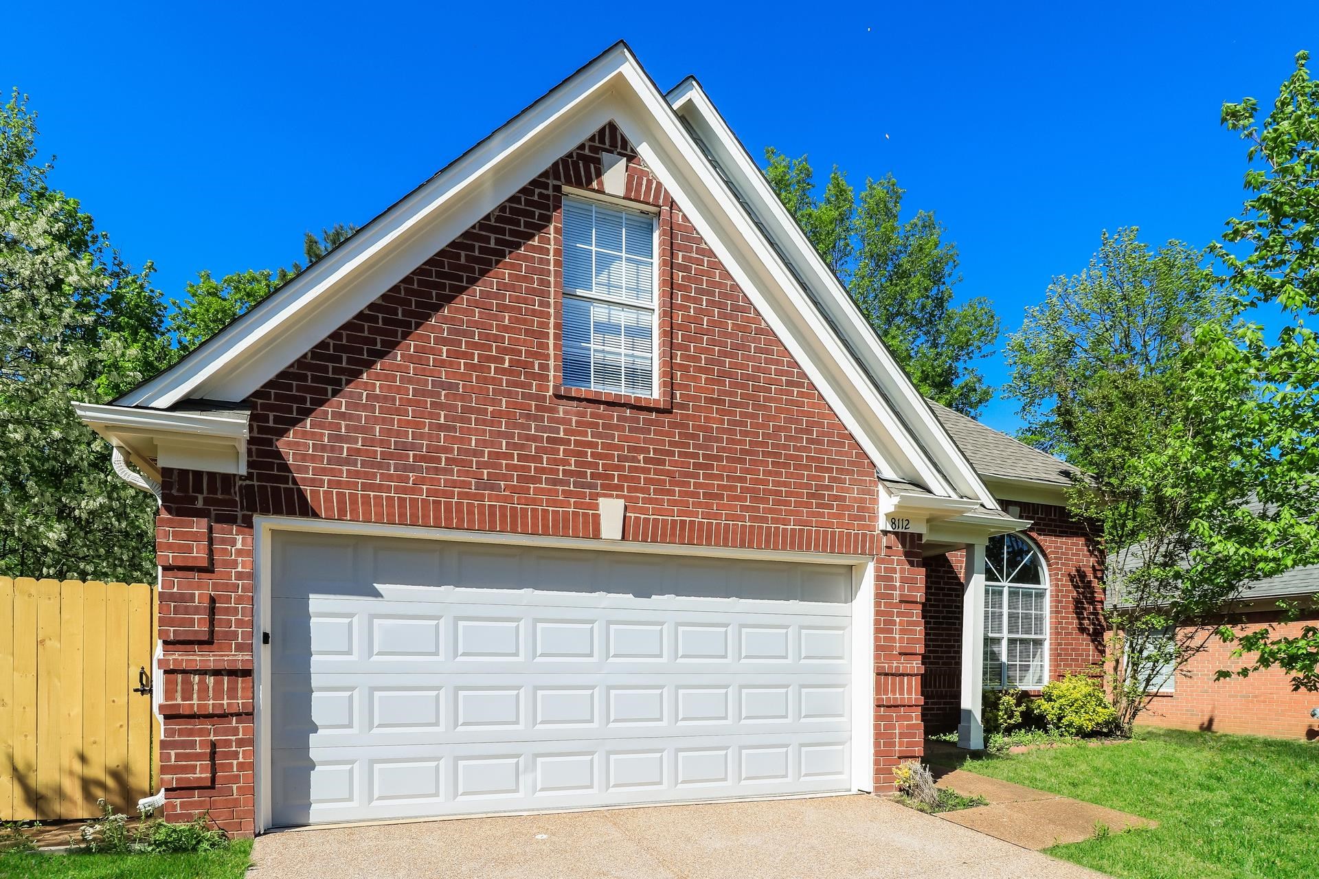 8112 Country Mill Cove Memphis, TN 38016 - Photo 2 of 17 a front view of a house with garage