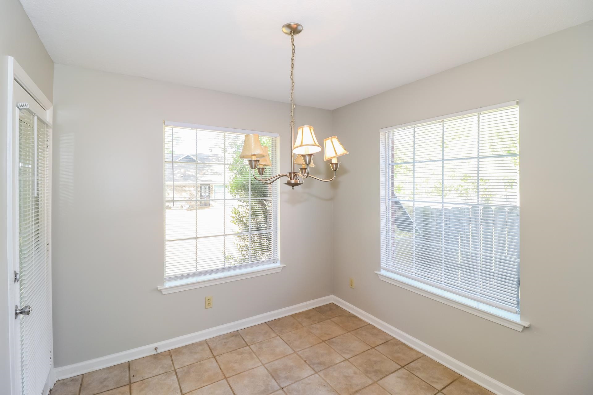 8112 Country Mill Cove Memphis, TN 38016 - Photo 5 of 17 a view of an empty room with a window