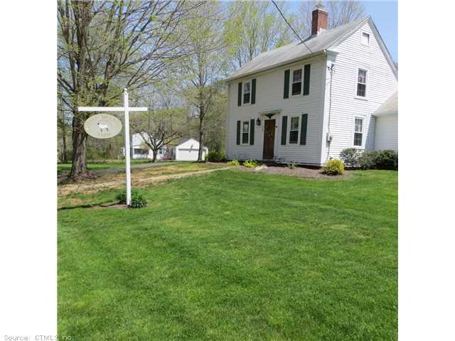a view of a yard in front of a house