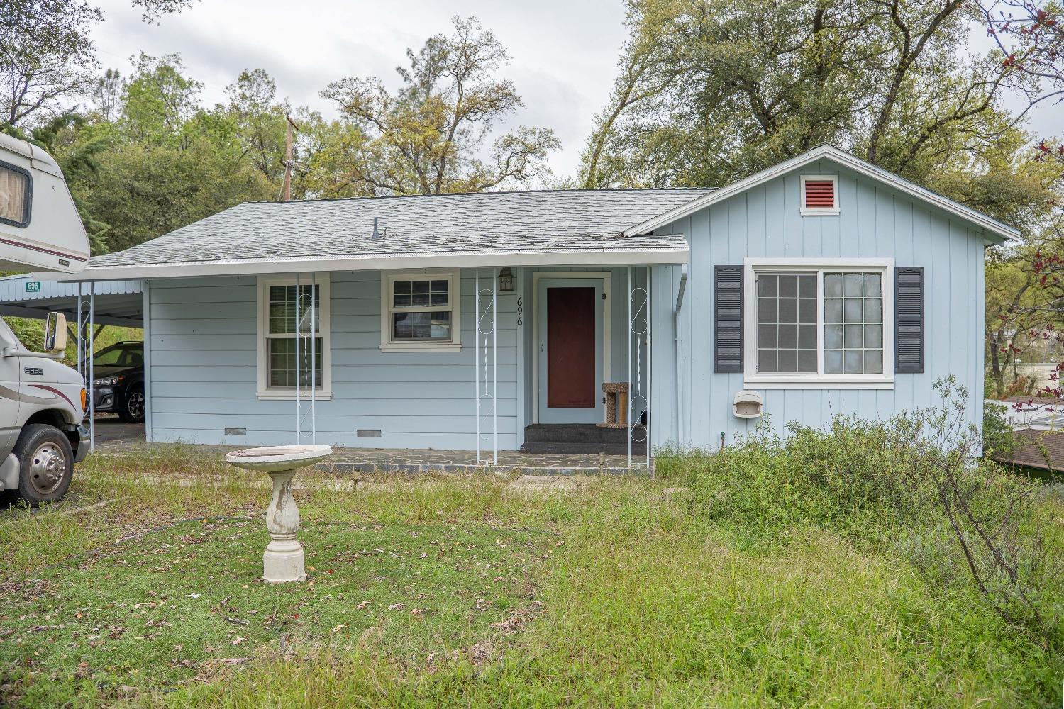 a front view of a house with garden