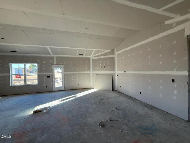 a view of empty room with windows