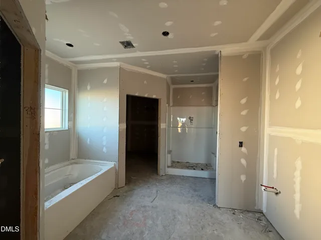a bathroom with a tub and shower