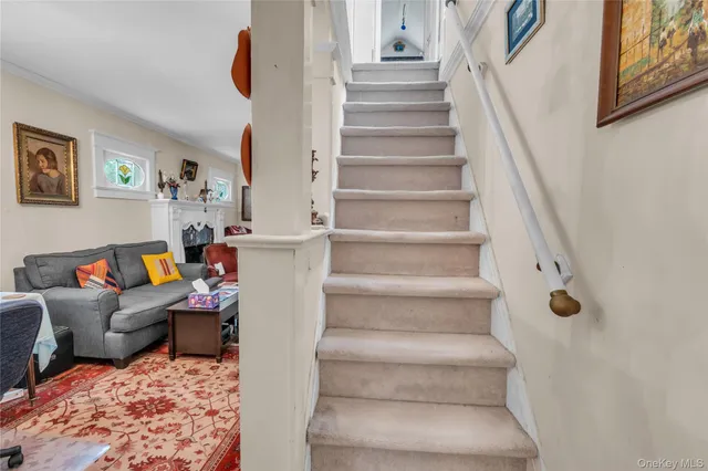 a living room with furniture and a rug