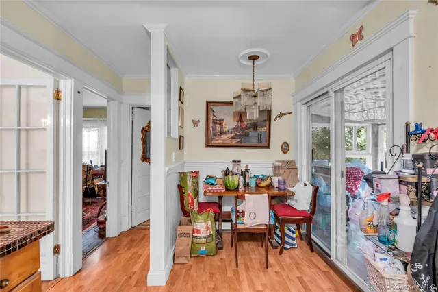 a dining room with lots of furniture and wooden floor