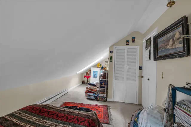 a white toilet sitting next to a bathroom sink and vanity