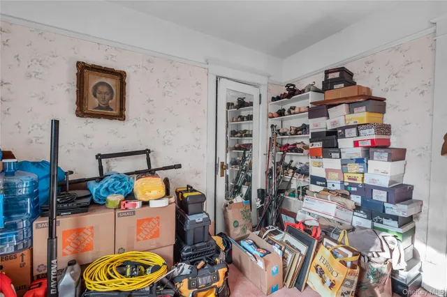 a living room with furniture and large windows