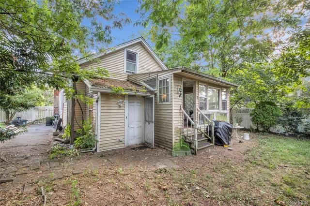 an aerial view of residential houses with outdoor space and street view