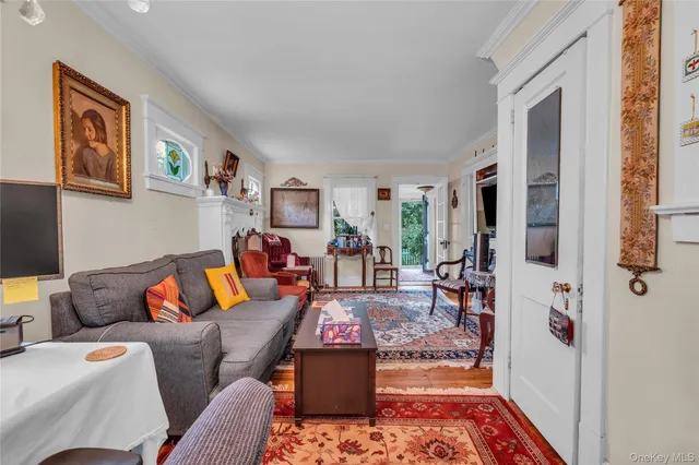 a living room with furniture and a rug