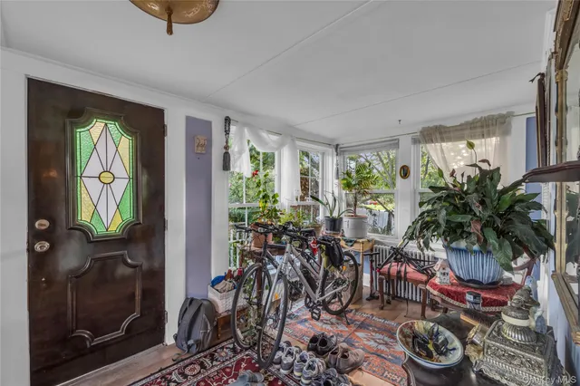 a room with lots of potted plants and a potted plant