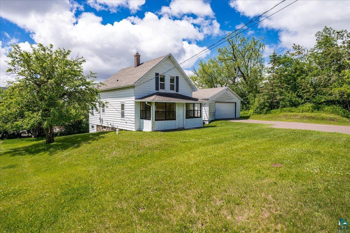 424 East Upham Road Duluth, MN 55811 - Photo 28 of 38 White clapboard siding with a covered porch
