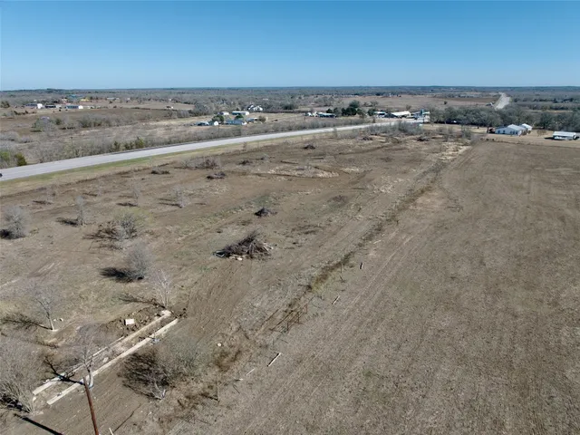 an aerial view of a yard with horses