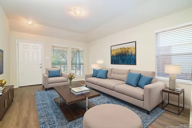 a living room with furniture and a couch