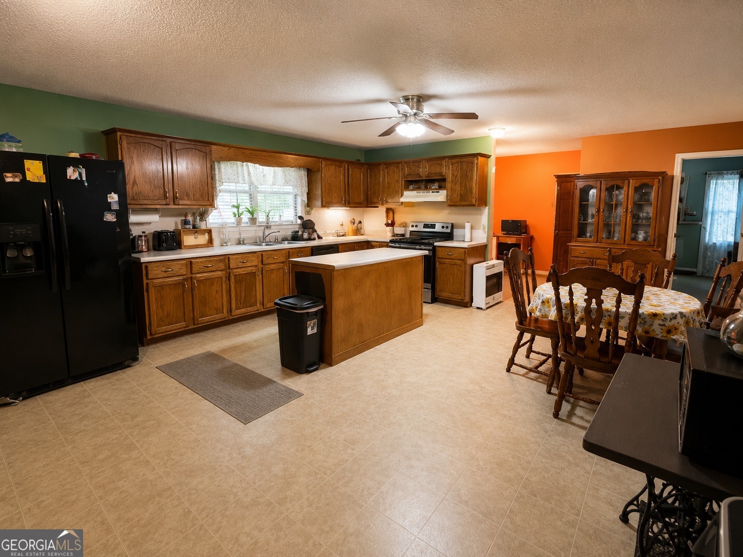 839 Cannafax Road Barnesville, GA 30204 - Photo 3 of 10 a kitchen with stainless steel appliances granite countertop a stove and a refrigerator