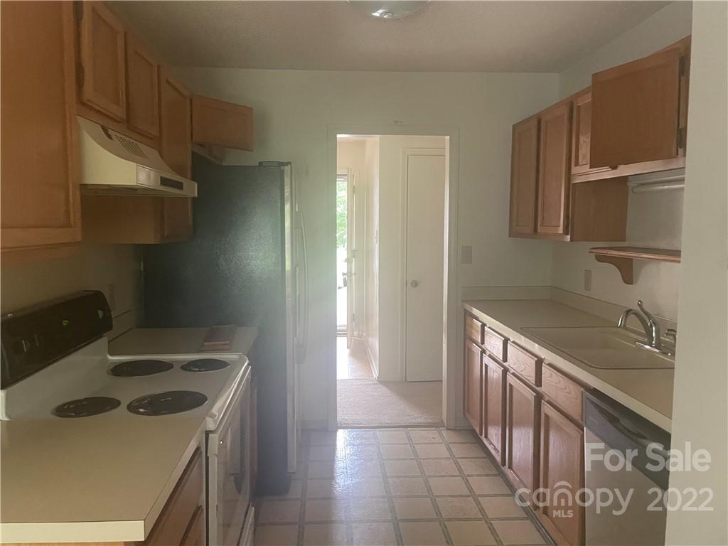 1639 Crestdale Road Rock Hill, SC 29732 - Photo 5 of 8 a kitchen with a sink stove and refrigerator