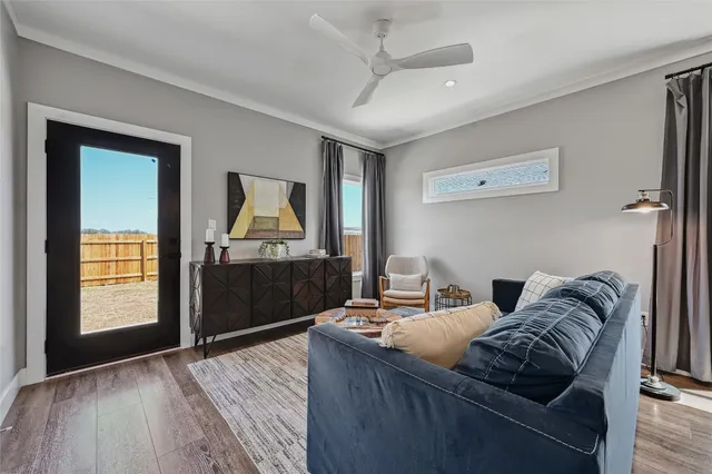 a living room with furniture and a window
