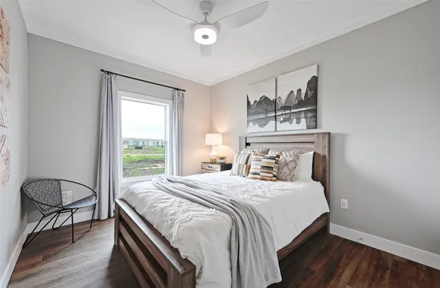 a bedroom with a large bed and a window