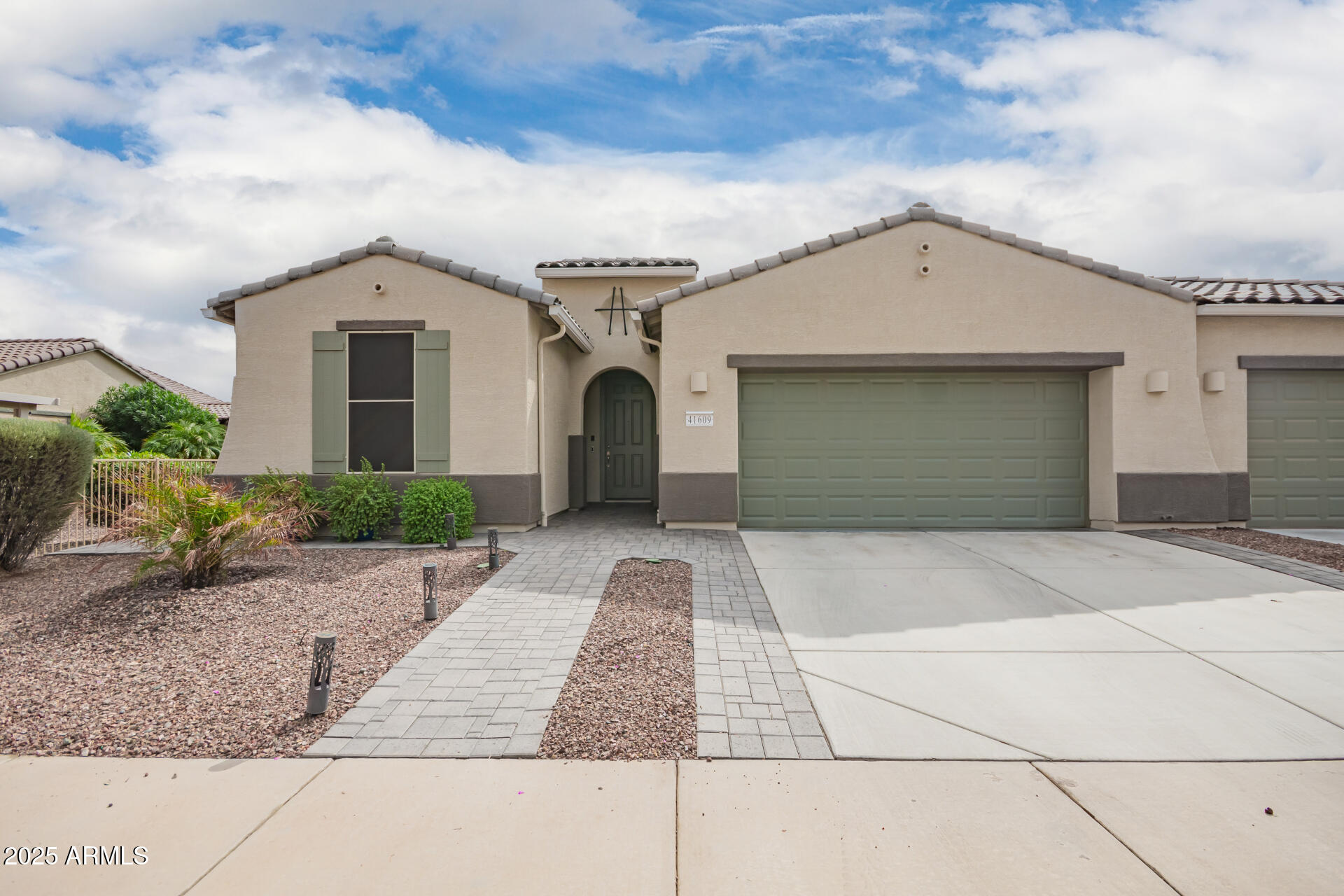 41609 West Summer Wind Way Maricopa, AZ 85138 - Photo 1 of 40 a front view of a house with a yard