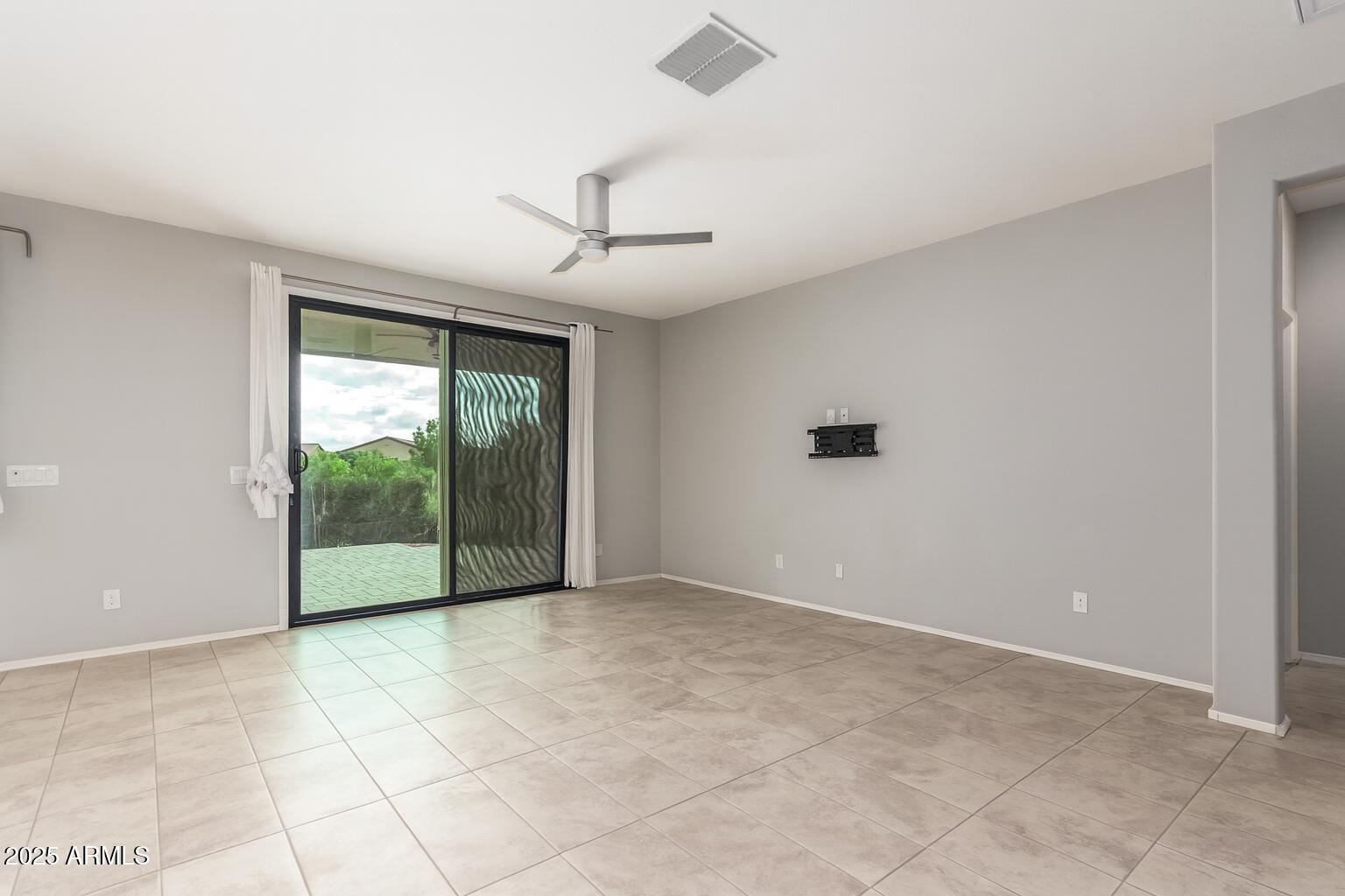 41609 West Summer Wind Way Maricopa, AZ 85138 - Photo 12 of 40 a view of an empty room with a window