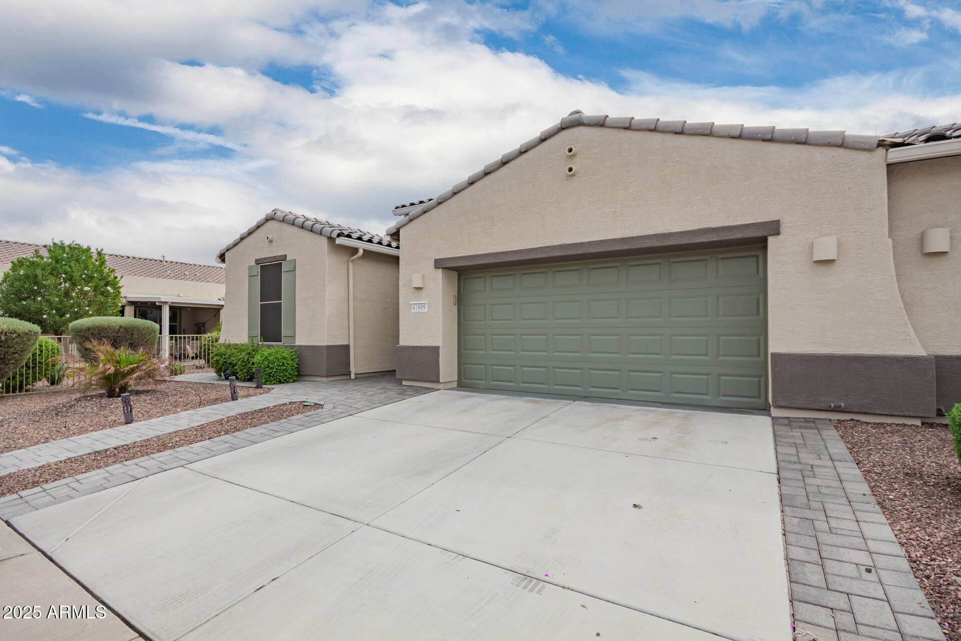 41609 West Summer Wind Way Maricopa, AZ 85138 - Photo 40 of 40 a front view of a house with garage