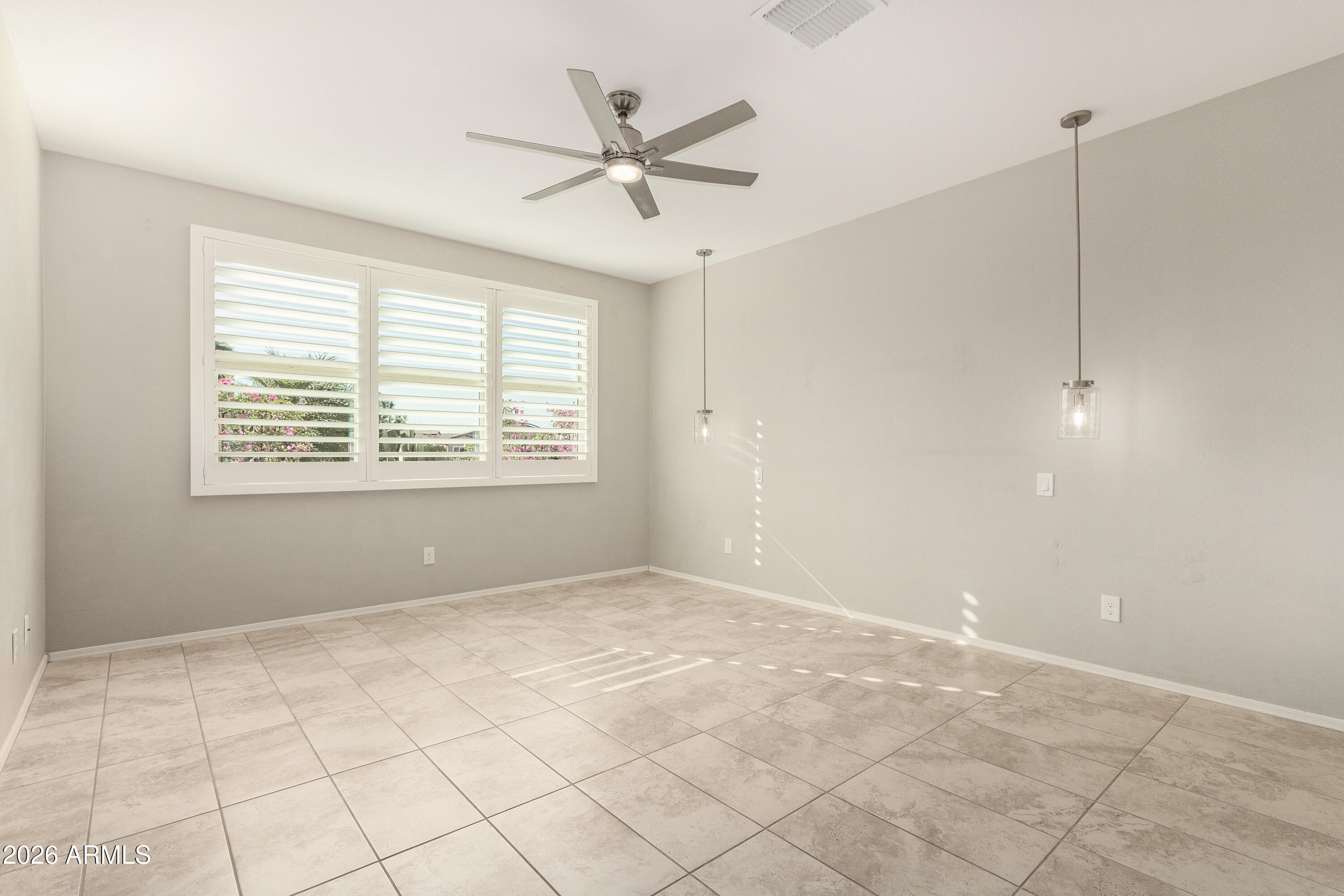41609 West Summer Wind Way Maricopa, AZ 85138 - Photo 7 of 40 a view of an empty room with a window