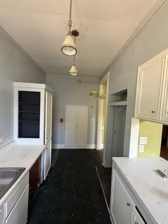a kitchen with a sink and stove